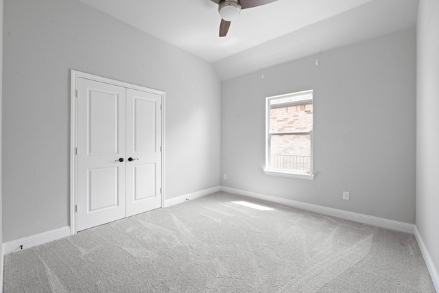 1038 Mickelson Dr, Granbury, TX 76048 - unfurnished bedroom with carpet, baseboards, a closet, a ceiling fan, and vaulted ceiling