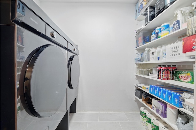 801 Edgefield Rd, Fort Worth, TX 76107 - laundry room featuring washing machine and clothes dryer and tile patterned flooring