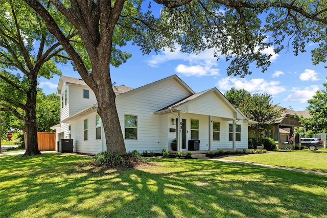 801 Edgefield Rd, Fort Worth, TX 76107 - view of front of home with cooling unit, a front yard, and covered porch