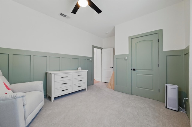 801 Edgefield Rd, Fort Worth, TX 76107 - living area with a decorative wall, light carpet, ceiling fan, and wainscoting