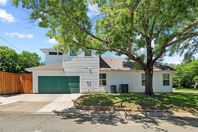 801 Edgefield Rd, Fort Worth, TX 76107 - view of front facade featuring driveway, cooling unit, a shingled roof, and a garage