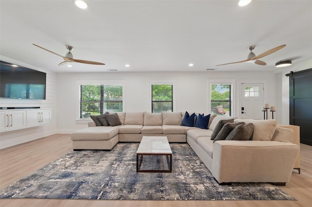 801 Edgefield Rd, Fort Worth, TX 76107 - living room with a barn door, ceiling fan, wood finished floors, recessed lighting, and baseboards