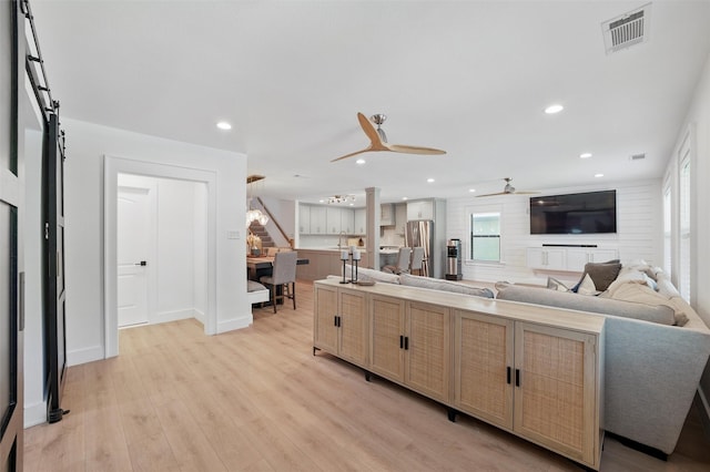 801 Edgefield Rd, Fort Worth, TX 76107 - living area with a ceiling fan, light wood-style floors, recessed lighting, a barn door, and baseboards