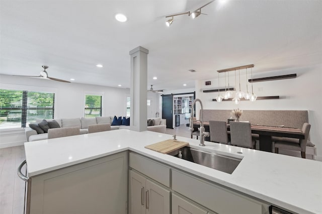801 Edgefield Rd, Fort Worth, TX 76107 - kitchen with ceiling fan, open floor plan, a sink, light countertops, and recessed lighting