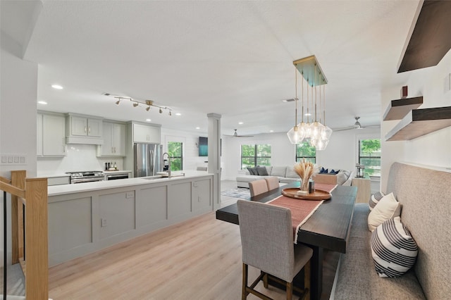 801 Edgefield Rd, Fort Worth, TX 76107 - dining room with light wood finished floors, recessed lighting, and decorative columns