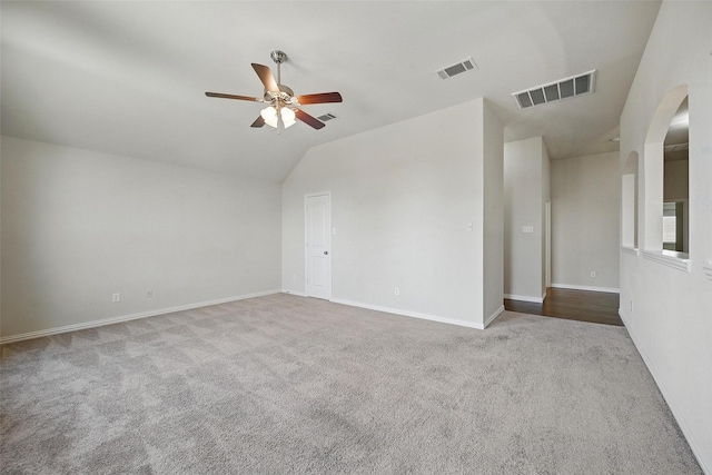 3813 Edward Dr, Mckinney, TX 75071 - empty room featuring lofted ceiling, carpet, a ceiling fan, arched walkways, and baseboards