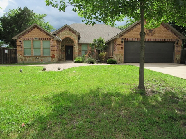 2817 Henry Rd, Lancaster, TX 75134 - view of front of home with stone siding, a garage, concrete driveway, and brick siding