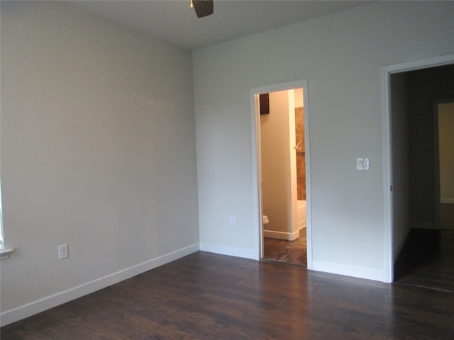 2817 Henry Rd, Lancaster, TX 75134 - spare room with dark wood-style flooring, a ceiling fan, and baseboards