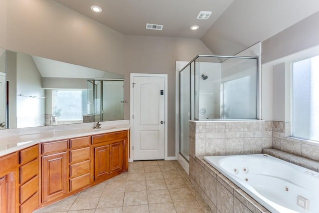 6306 Shadow Valley Dr, Burleson, TX 76028 - full bath with healthy amount of natural light, a stall shower, lofted ceiling, a tub with jets, and tile patterned floors