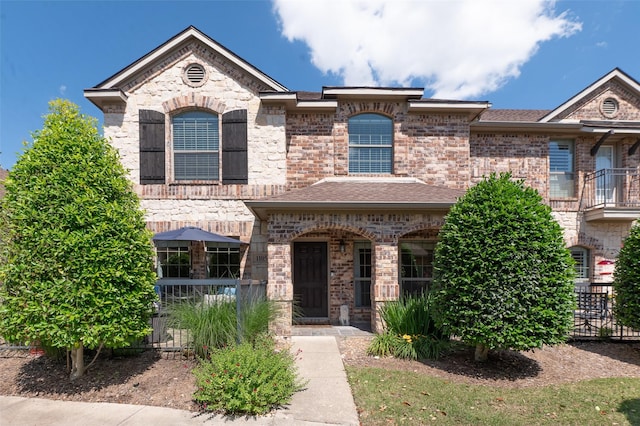 3075 Willow Grove Blvd Unit 1105, Mckinney, TX 75070 - view of front of house featuring brick siding and roof with shingles