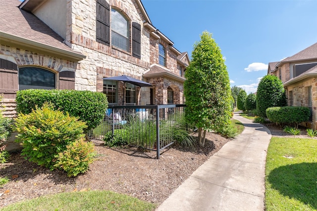 3075 Willow Grove Blvd Unit 1105, Mckinney, TX 75070 - view of property exterior with stone siding and brick siding