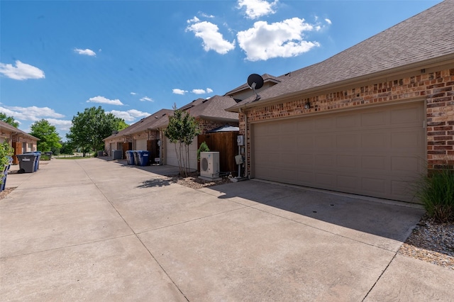 3075 Willow Grove Blvd Unit 1105, Mckinney, TX 75070 - view of front of property featuring brick siding, a shingled roof, driveway, and an attached garage