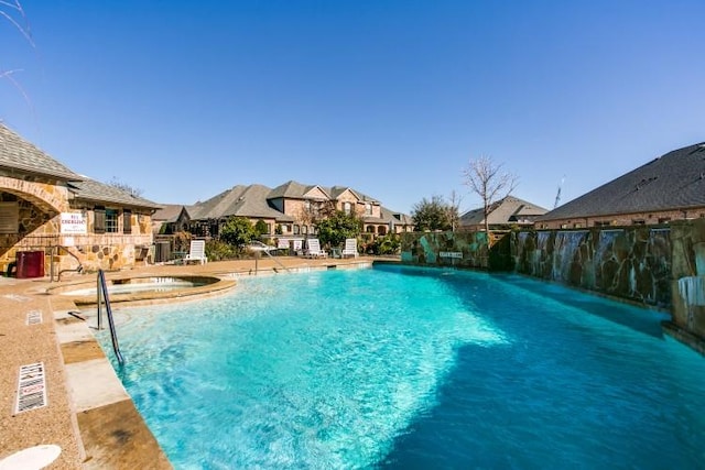 3075 Willow Grove Blvd Unit 1105, Mckinney, TX 75070 - community pool featuring a hot tub and a residential view