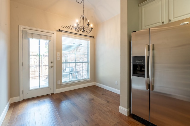 3075 Willow Grove Blvd Unit 1105, Mckinney, TX 75070 - kitchen featuring stainless steel fridge with ice dispenser, a chandelier, hardwood / wood-style flooring, white cabinetry, and decorative light fixtures