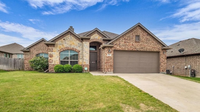4907 Lakepark Dr, Sanger, TX 76266 - french provincial home with concrete driveway, a chimney, brick siding, and a garage