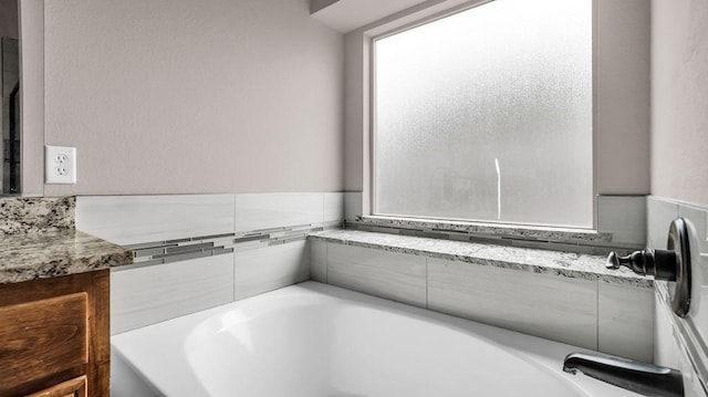 4907 Lakepark Dr, Sanger, TX 76266 - bathroom with a bath and healthy amount of natural light