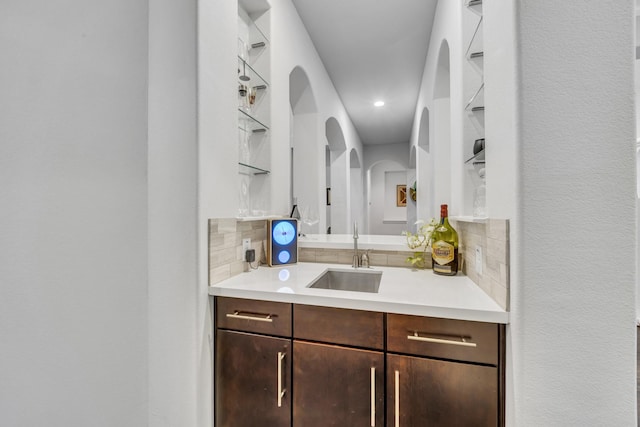 212 Saint Tropez Dr, Southlake, TX 76092 - indoor bar with decorative backsplash, arched walkways, and recessed lighting