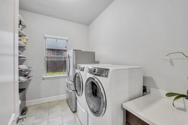 212 Saint Tropez Dr, Southlake, TX 76092 - laundry room featuring washer and dryer, light tile patterned flooring, and baseboards