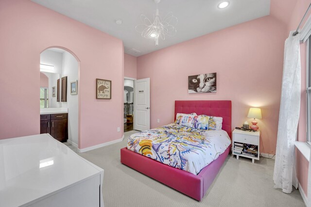 212 Saint Tropez Dr, Southlake, TX 76092 - carpeted bedroom with arched walkways, a chandelier, baseboards, recessed lighting, and connected bathroom