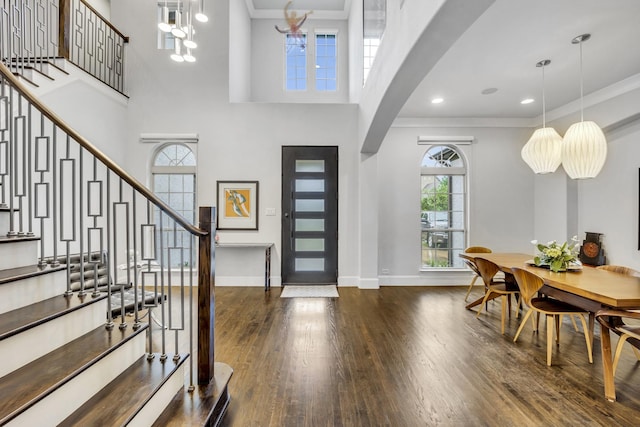 212 Saint Tropez Dr, Southlake, TX 76092 - entrance foyer featuring dark wood finished floors, baseboards, stairway, crown molding, and a towering ceiling