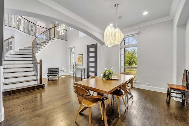 212 Saint Tropez Dr, Southlake, TX 76092 - dining space with stairway, wood finished floors, arched walkways, baseboards, and crown molding