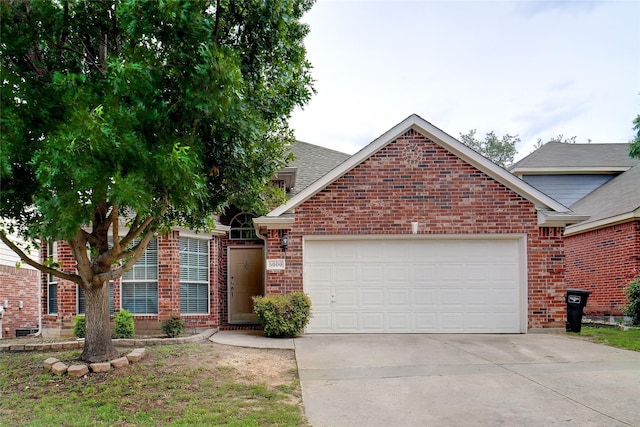 5000 Coral Creek Dr, Fort Worth, TX 76135 - view of front facade featuring brick siding, an attached garage, driveway, and a shingled roof
