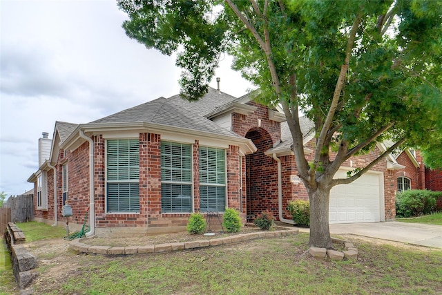 5000 Coral Creek Dr, Fort Worth, TX 76135 - view of front of property with driveway, a garage, brick siding, and roof with shingles