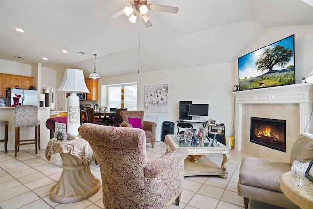 5000 Coral Creek Dr, Fort Worth, TX 76135 - living area with light tile patterned floors, a tiled fireplace, a ceiling fan, recessed lighting, and vaulted ceiling