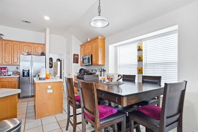 5000 Coral Creek Dr, Fort Worth, TX 76135 - dining area featuring vaulted ceiling and light tile patterned floors