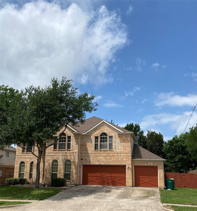 1435 Delta Dr, Cedar Hill, TX 75104 - view of front of home featuring brick siding, driveway, a shingled roof, and a garage