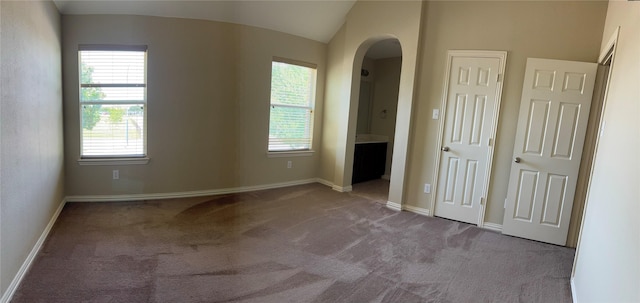 1435 Delta Dr, Cedar Hill, TX 75104 - empty room featuring arched walkways, carpet flooring, and baseboards