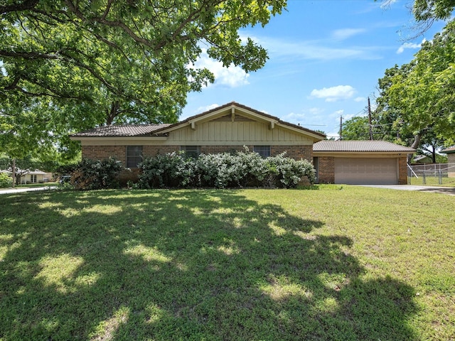 ranch-style home with brick siding, an attached garage, and driveway