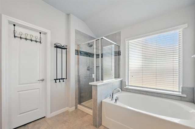 3812 Wheatland Trl, Forney, TX 75126 - bathroom featuring a garden tub, a stall shower, healthy amount of natural light, lofted ceiling, and baseboards