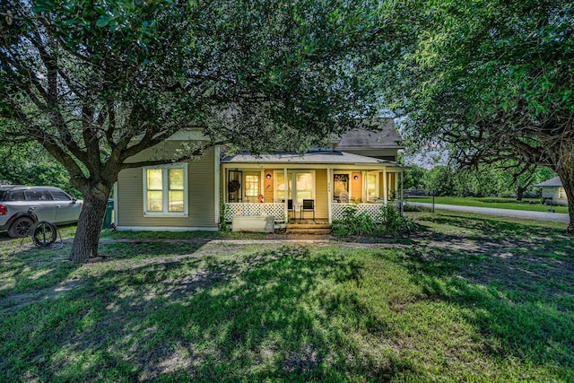 209 S Britton St, Tom Bean, TX 75489 - view of front of house featuring covered porch and a front yard