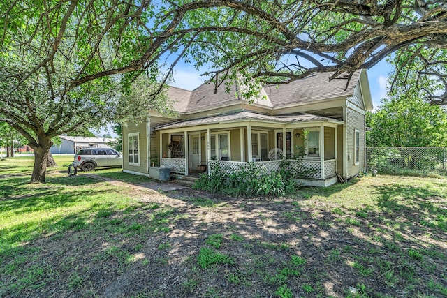 209 S Britton St, Tom Bean, TX 75489 - view of side of home featuring covered porch and roof with shingles
