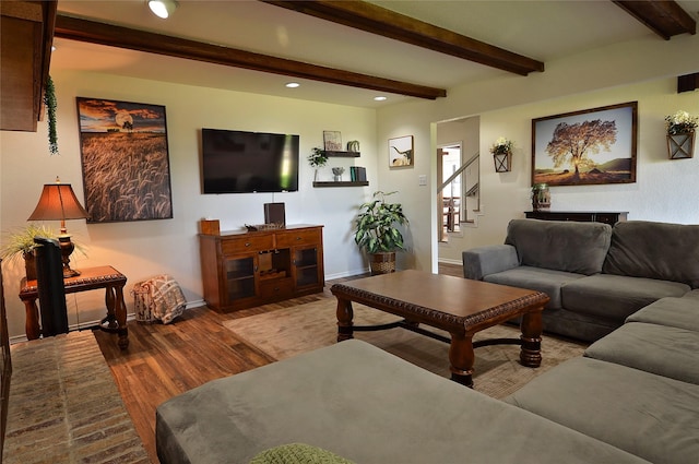 701 Elmhill Blvd, Burleson, TX 76028 - living room with wood finished floors, baseboards, stairway, recessed lighting, and beamed ceiling