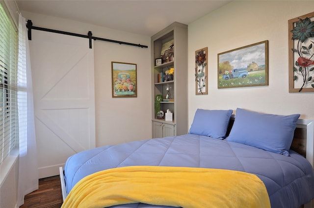 701 Elmhill Blvd, Burleson, TX 76028 - bedroom with a barn door and dark wood finished floors