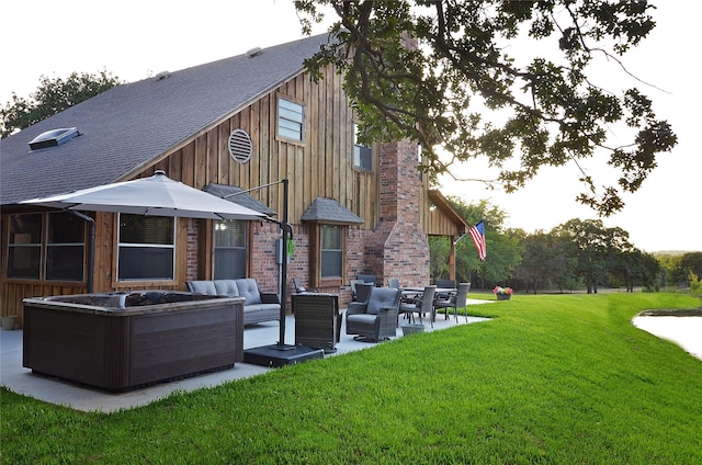 701 Elmhill Blvd, Burleson, TX 76028 - back of property featuring an outdoor living space, a yard, a patio, a shingled roof, and board and batten siding