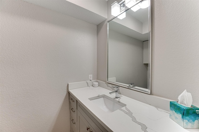3326 Courtyard Pl, Farmers Branch, TX 75234 - bathroom featuring a textured wall and vanity
