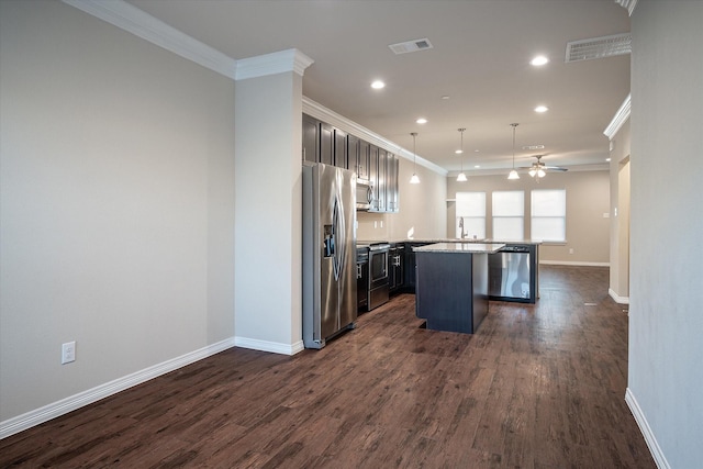 101 Springtree St, Denton, TX 76209 - kitchen with appliances with stainless steel finishes, crown molding, dark wood-style floors, a ceiling fan, and recessed lighting
