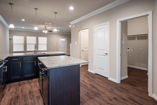 101 Springtree St, Denton, TX 76209 - kitchen with ornamental molding, a sink, a kitchen island, ceiling fan, and light stone counters
