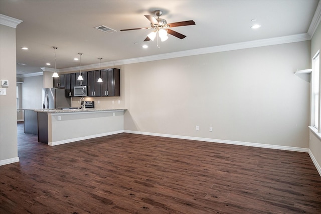 101 Springtree St, Denton, TX 76209 - kitchen featuring appliances with stainless steel finishes, ornamental molding, a ceiling fan, dark wood finished floors, and baseboards