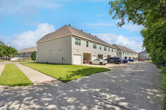 101 Springtree St, Denton, TX 76209 - view of home's exterior featuring a yard, an attached garage, and a residential view