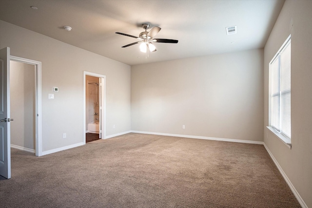 101 Springtree St, Denton, TX 76209 - unfurnished room with carpet floors, a ceiling fan, and baseboards