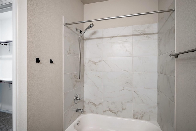 101 Springtree St, Denton, TX 76209 - bathroom with a textured wall and shower / bathtub combination