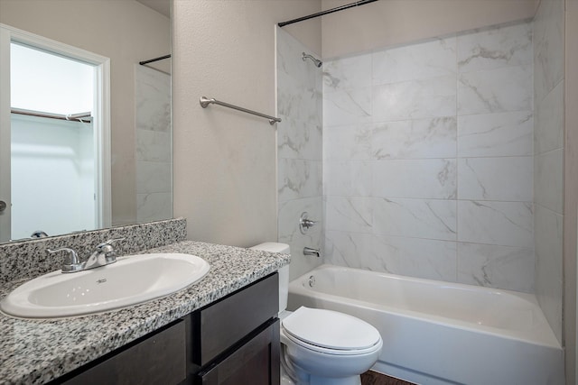 101 Springtree St, Denton, TX 76209 - bathroom with washtub / shower combination, toilet, vanity, and a textured wall