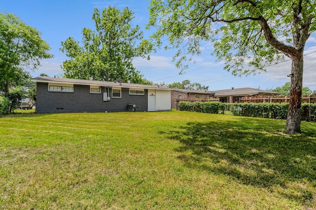 2409 Klondike Dr, Dallas, TX 75228 - back of house featuring crawl space and brick siding