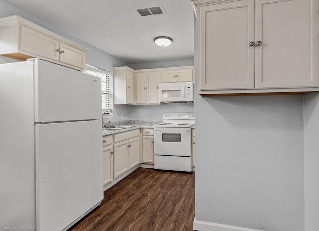 2409 Klondike Dr, Dallas, TX 75228 - kitchen featuring white appliances, a sink, dark wood finished floors, light stone counters, and baseboards