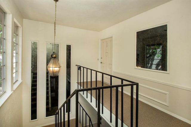 10578 High Hollows Dr Unit 269, Dallas, TX 75230 - hall featuring carpet flooring, an upstairs landing, and baseboards