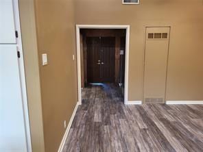 5728 Rockhill Rd, Fort Worth, TX 76112 - hall featuring baseboards and dark wood-style floors